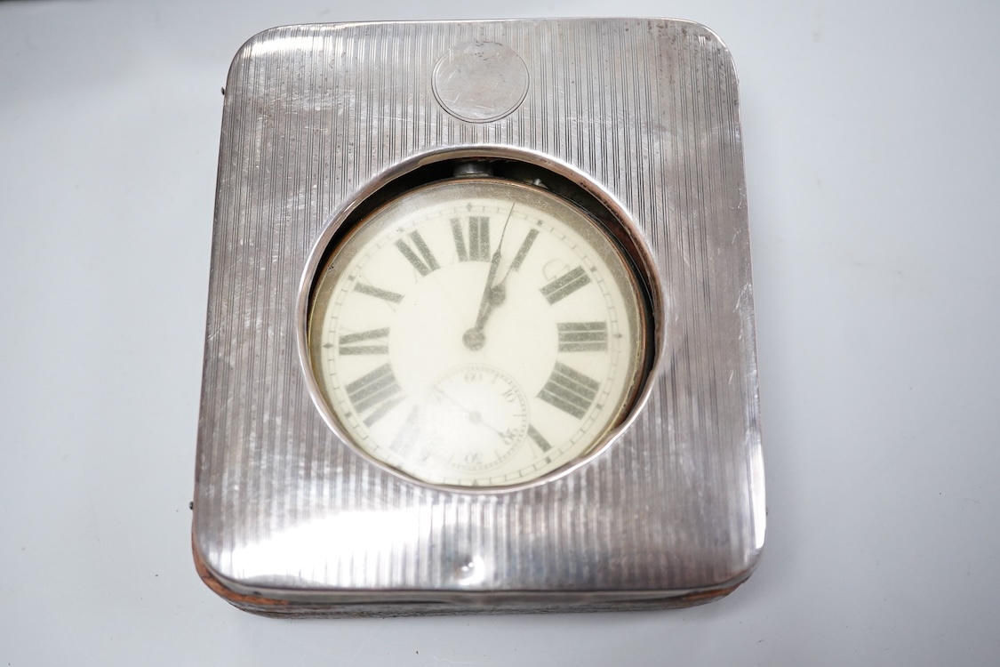 Two George V silver mounted travelling watch cases, both Birmingham, 1921, both containing chrome cased pocket watches. largest case 11.4cm.